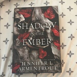 A Shadow in the Ember Novel with Red and Black Cover